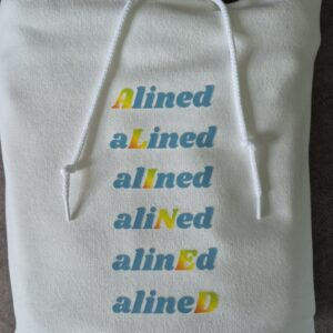 White hoodie with stacked multicolored "Alined" text